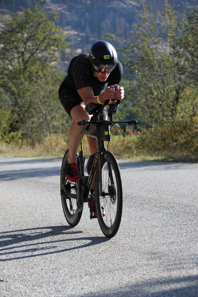 Jay on the aero bars during a 2024 triathlon bike leg